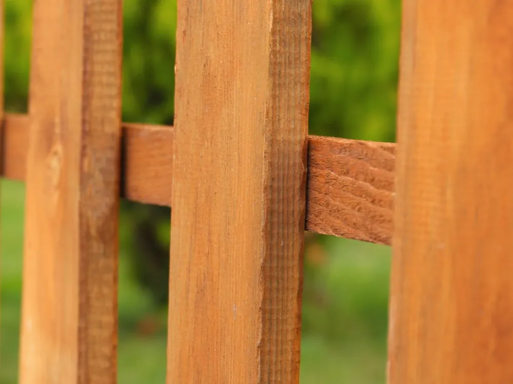 Close view of a wood picket fence